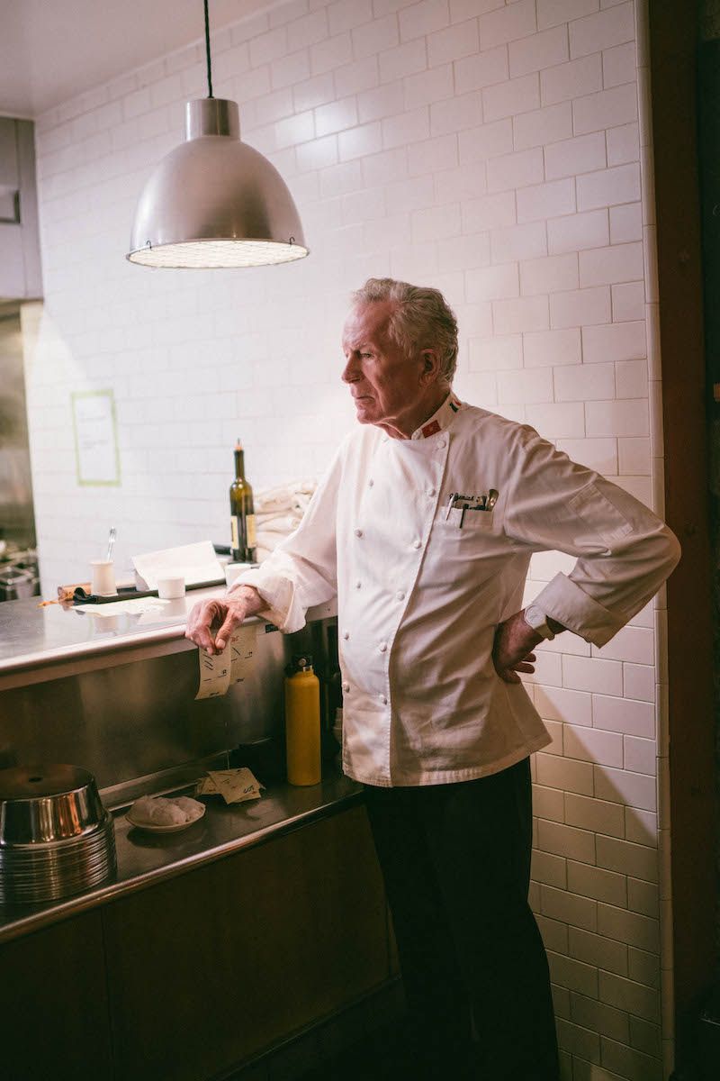 Jeremiah Tower watching the tickets at the pass at Foreign Cinema