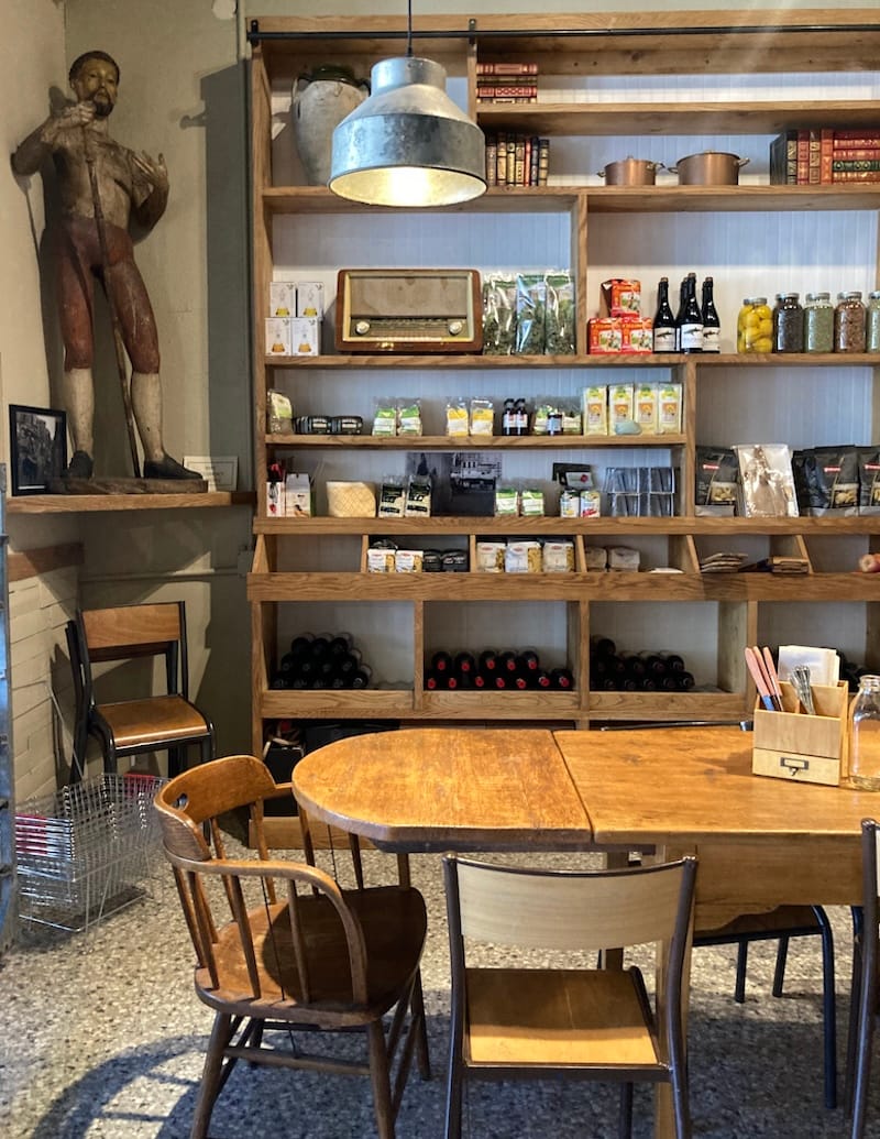An early peek at some of the retail shelving, a communal table, and St. Francis watching over you. Photo: Bureau Jules.