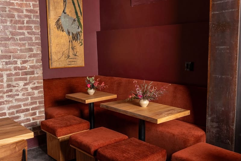 The cozy corner tables and banquette. Photo: Carly Hackbarth.