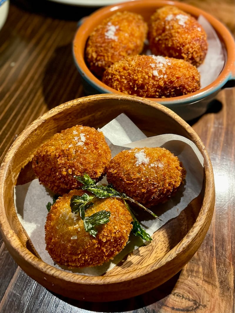 Enjoy some of Montesacro Marina’s supplì al telefono or seasonal fritters with your half-off bubbles on Tuesdays. Photo: © tablehopper.com.