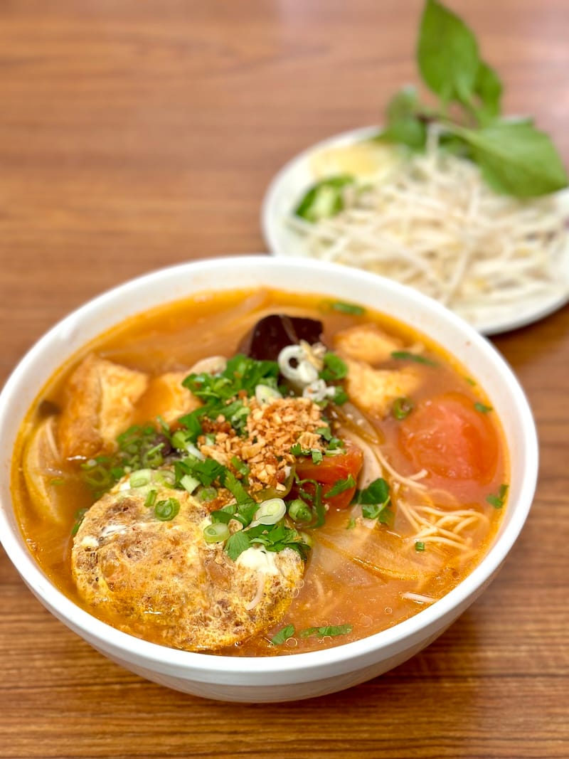 Exactly the bowl of bún riêu noodle soup you need for our upcoming stormy weather. Read where to get it below! Photo: © tablehopper.com.