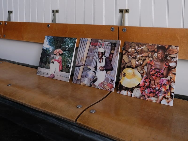 A selection of records from Side A’s collection on Universal Cafe’s wood banquette. Photo courtesy of Side A. 