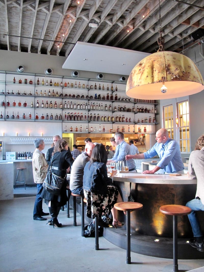 Erik Adkins stirring a cocktail at an opening party for Hard Water in 2013. Photo: © tablehopper.com.