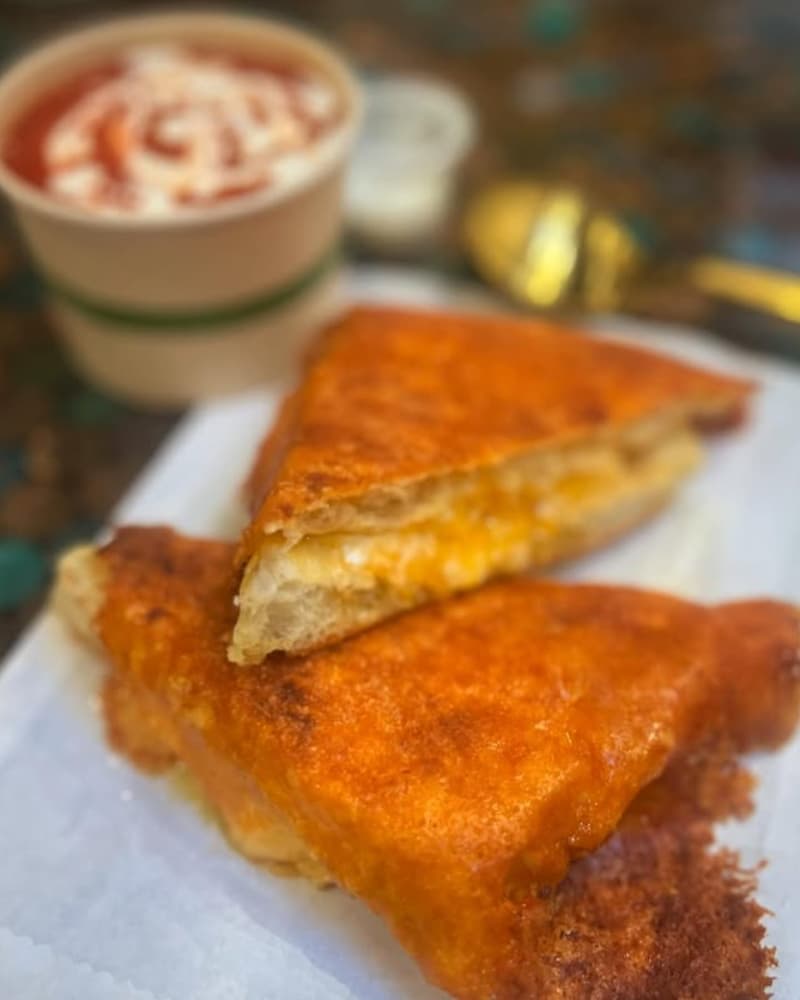 Check out the Shmelty (cheddar and mozzarella inside out on schiacciata that Andytown is baking for them), ready to dip into tomato soup at Rusty Ladle. Instagram photo via @rustyladlesf.