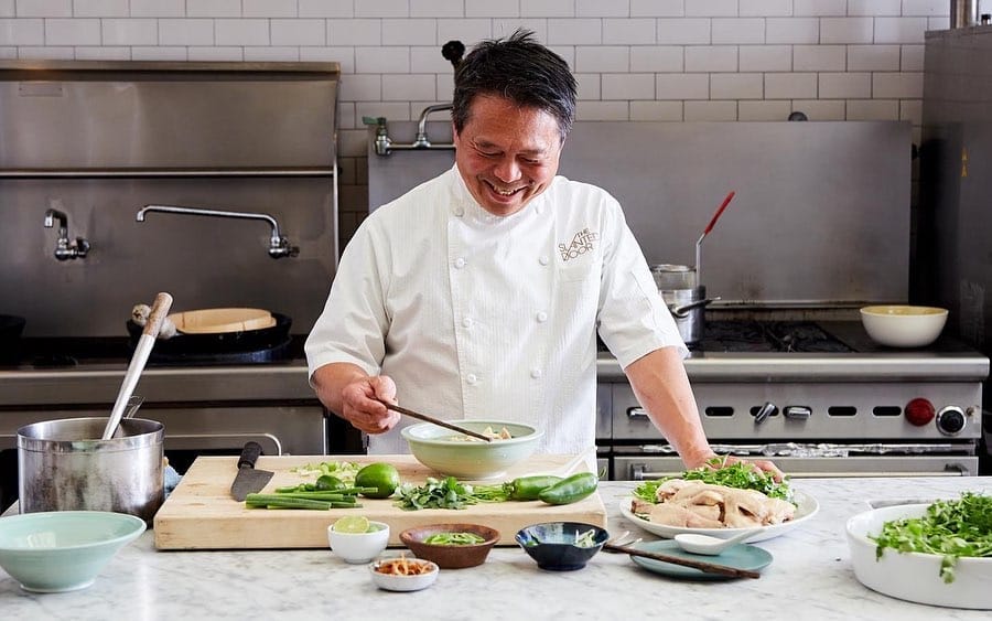 Charles Phan in the kitchen making phở gà. Photo via Slanted Door’s Facebook page.