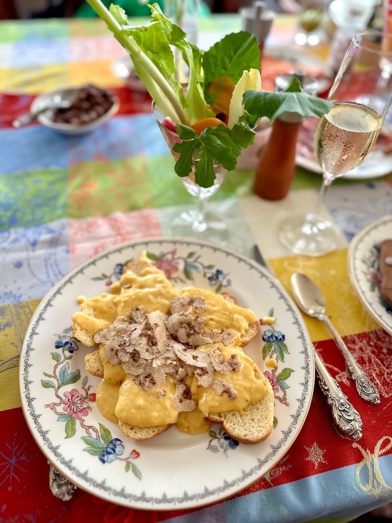 A pic from the annual truffle brunch hosted by my culinary fairy godmother, Roberta Klugman. She always sets the most beautiful table (look at that garden salad in a glass!) while I slowly stir our buttery and creamy eggs for thirty minutes before they get poured over golden slices of brioche. Photo: © tablehopper.com.