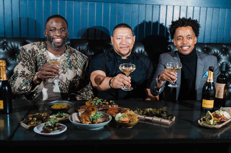 Left to right: Draymond Green, Nelson German, and Guma Fassil celebrate their diasporic dining concept. Photo: ⓒ Megan Latify.