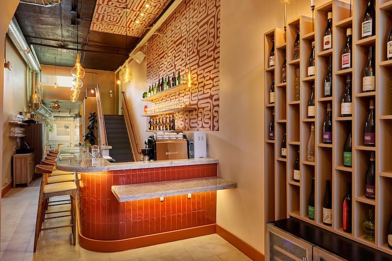 The front bar and retail wine rack at Caché. Photo: Joseph Weaver.