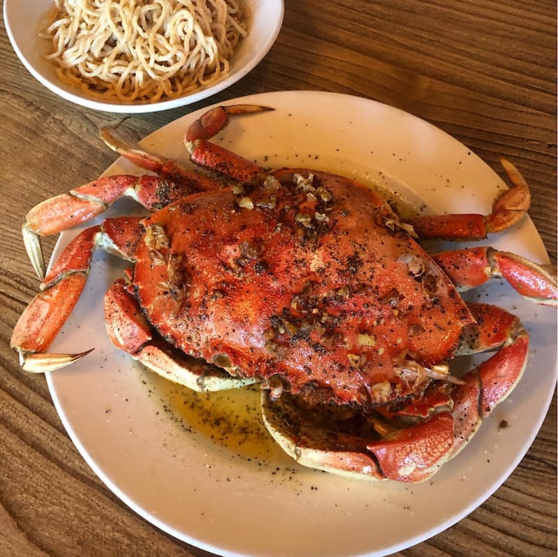 The famed roasted crab and garlic noodles at Crustacean. Instagram photo via @crustacean_sf.