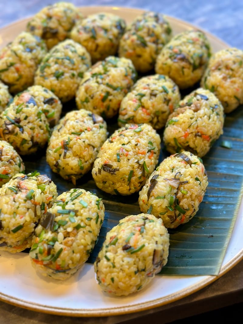 Jushi (Okinawan-style mixed rice balls, with sticky and sushi rice) are made with tuna, carrot, turmeric, sometimes pork, and so much more. Photo: © tablehopper.com. 