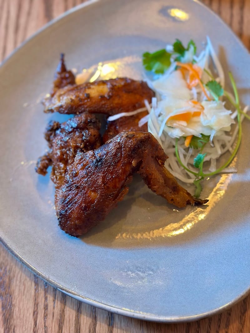 Cánh gà chiên (Hanoi-style fried chicken wings). And check out the new plates! Photo: © tablehopper.com.